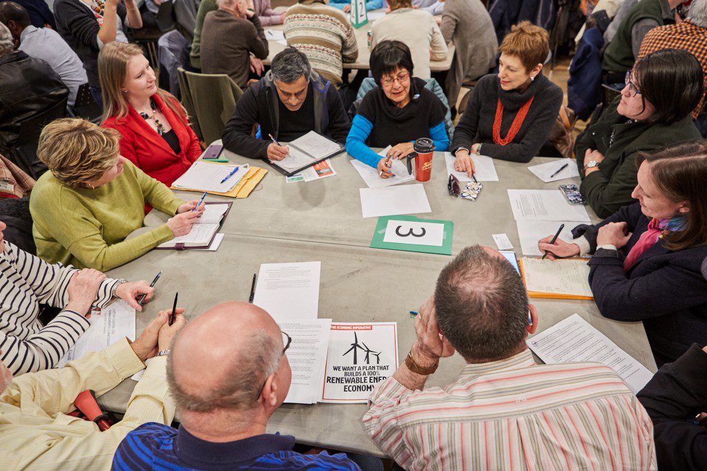 One of dozens of tables of people discussing climate action.