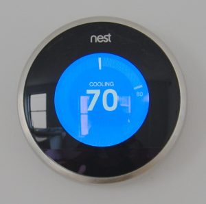 A Nest smart thermostat reading 70 degrees