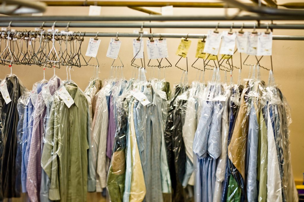Clothing on racks at a dry cleaner
