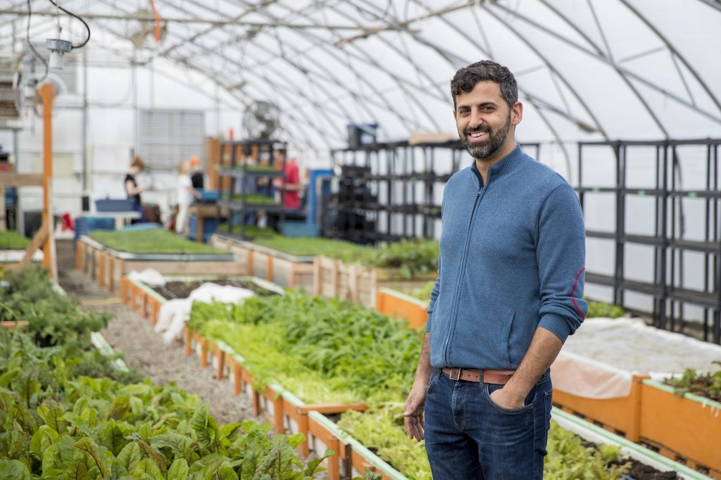 Ran Goel standing in the greenhouse