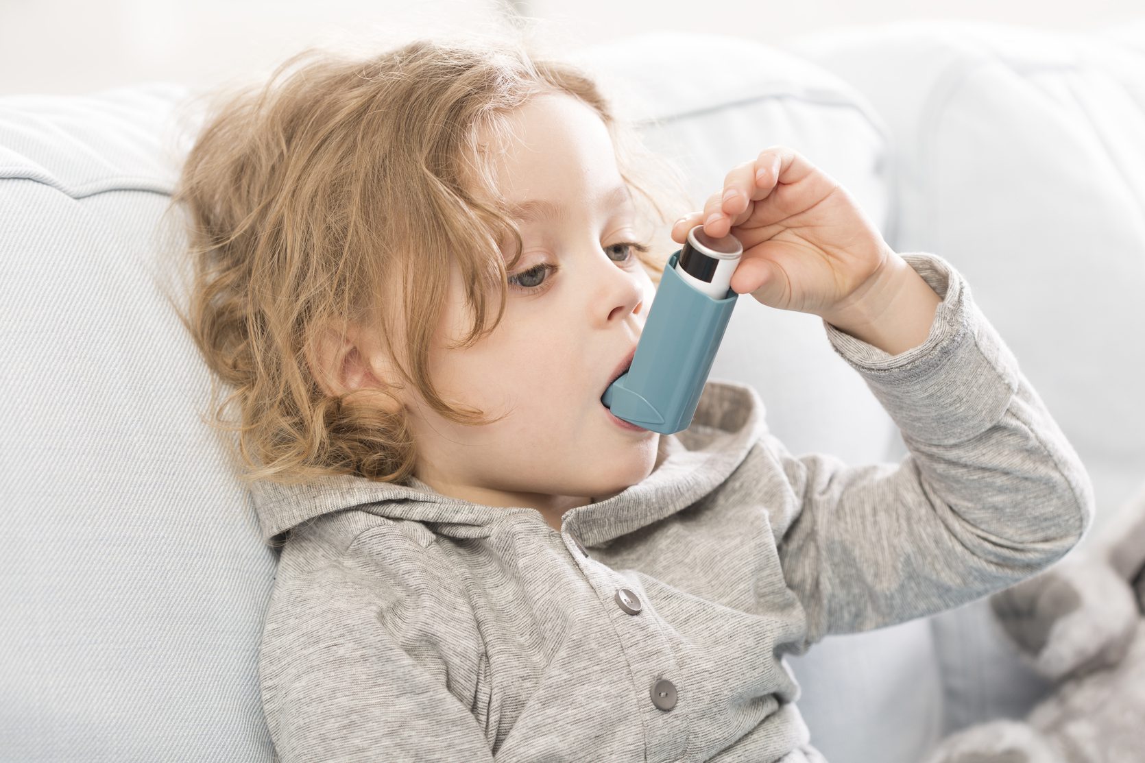 Child with asthma inhaler