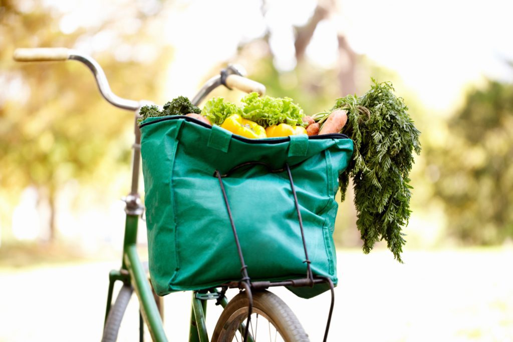Cropped image of a bag of vegatables on a bike
