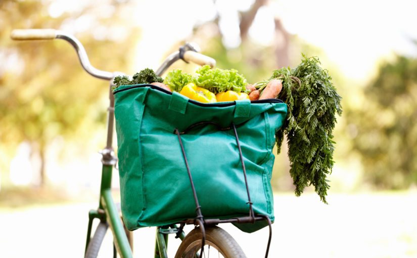 Cropped image of a bag of vegatables on a bike