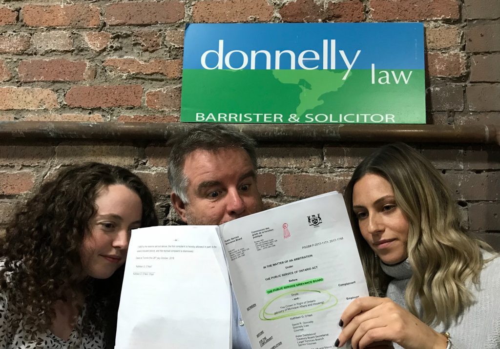 Lawyer David Donnelly and his associates, Sara Gray (left) and Alex Whyte react to the court’s decision in favour of Victor Doyle.