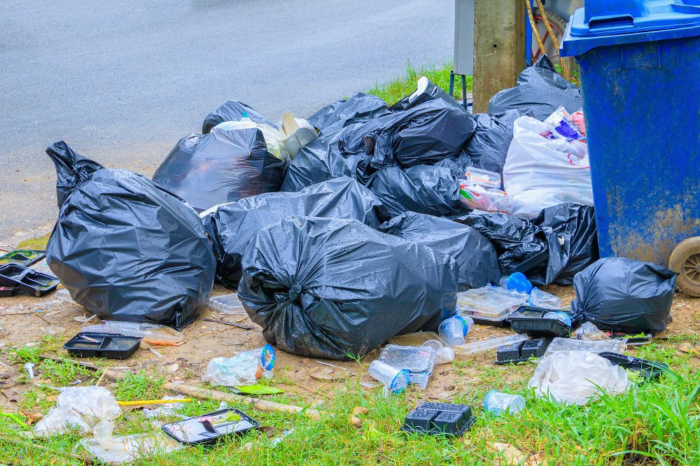 garbage pile on curbside the blue box recycling