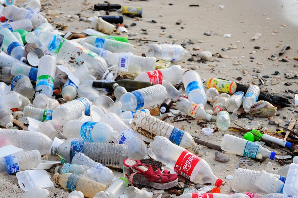 Kota Kinabalu, Malaysia - March 16, 2016: Garbage and plastic bottles on a beach left in Kota Kinabalu beach in Sabah Borneo, Malaysia. Just like many Asian countries, Malaysia have problems with waste management due to ignorance and low awareness.