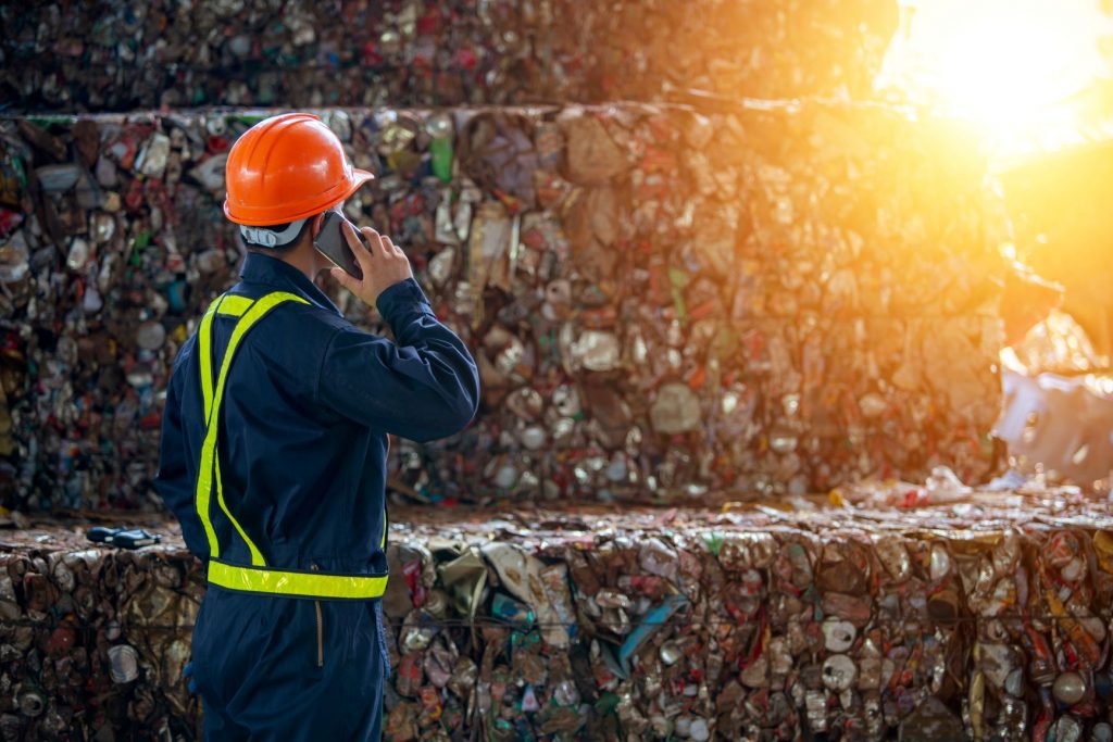 man working at a recycling facility