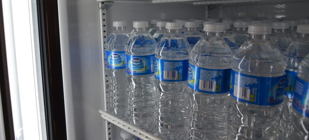 water bottles in a fridge at a store