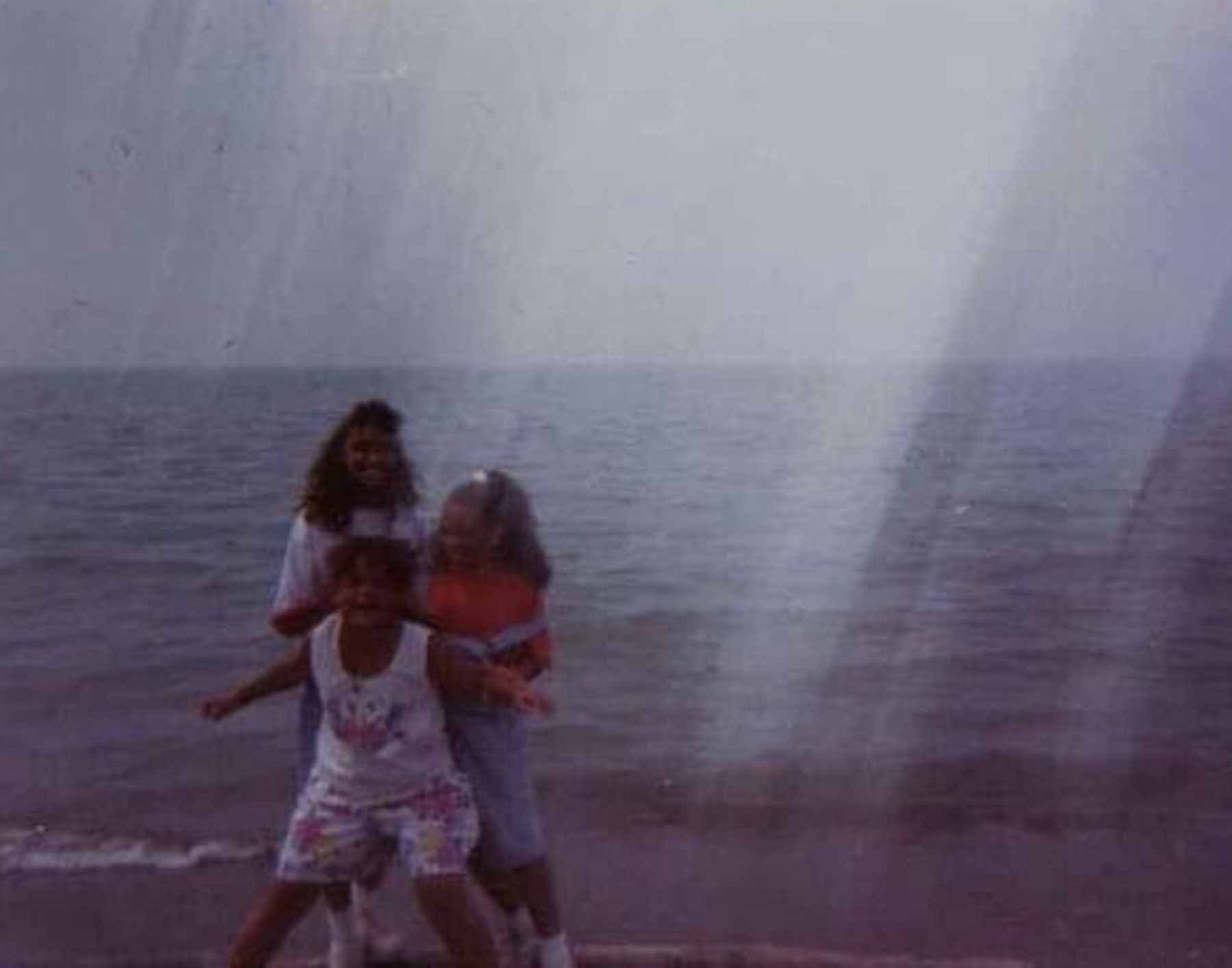 Michelle as a child with her sister and cousin at Burns Beach.