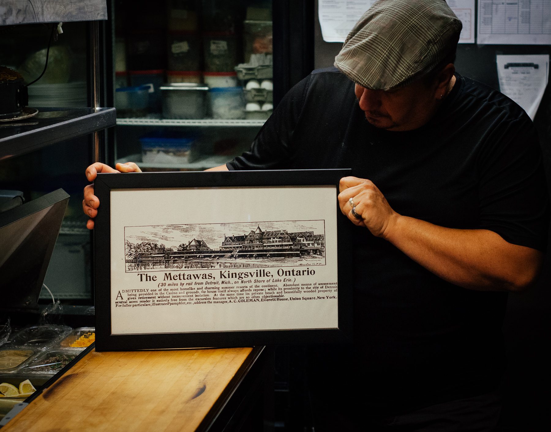 Anthony shows an old advertisement for The Mettawas Resort.