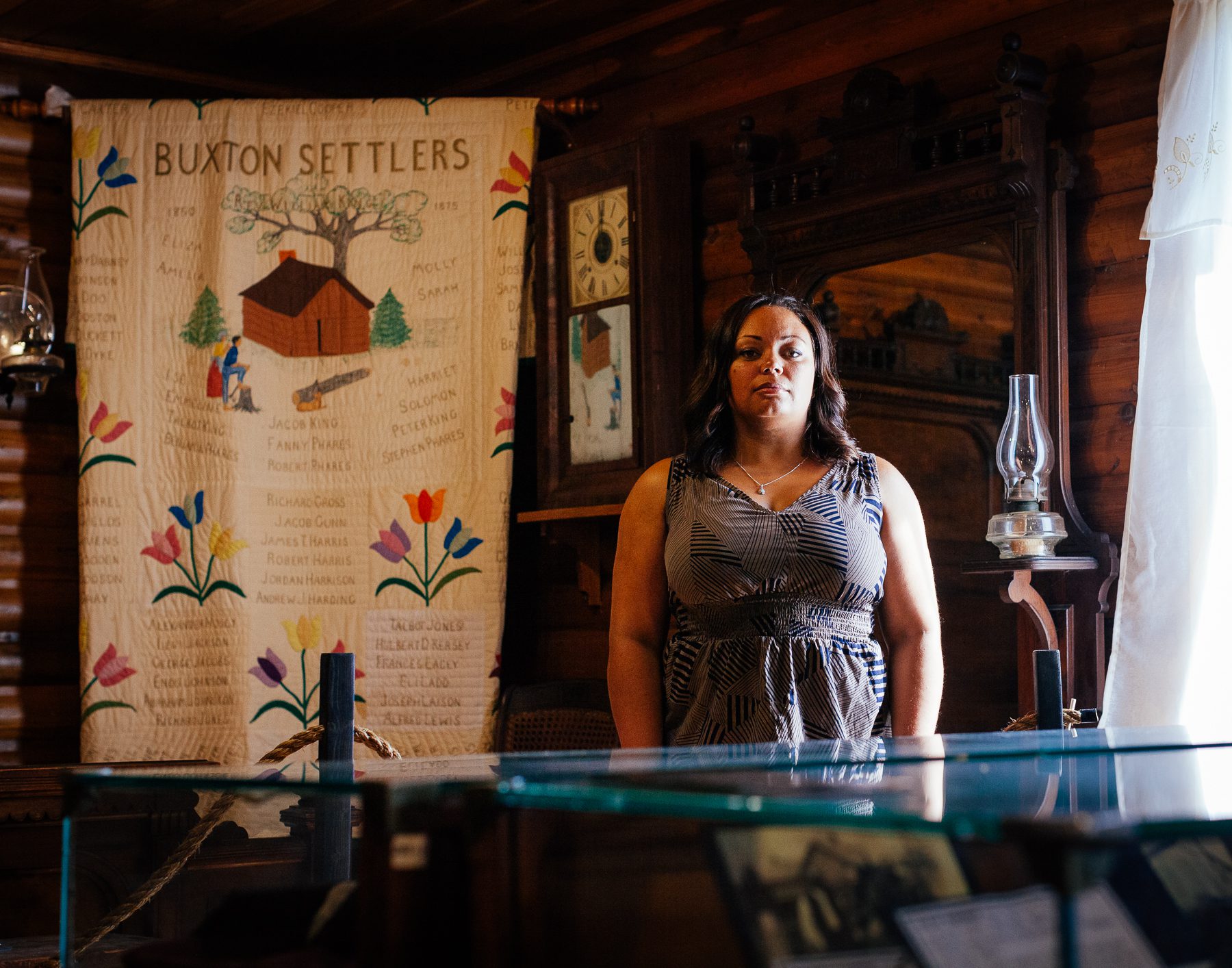  Michelle stands amongst an exhibit in the Buxton National Historic Museum opened in 1967 to collect, preserve, exhibit, and interpret historical artifacts related to the community settlers and their descendants.