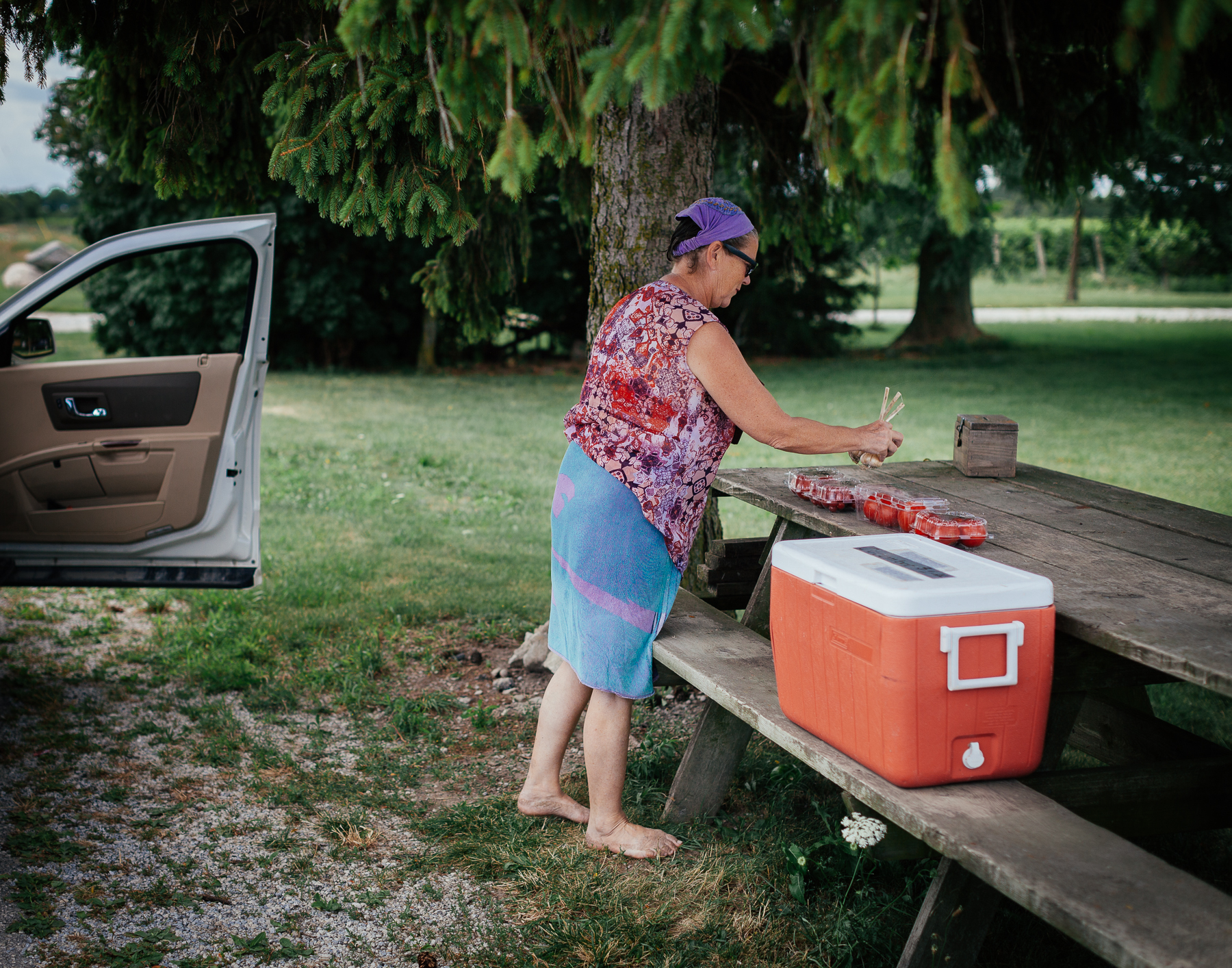 After a swim in the lake, Patricia stops at local farmer Bruno’s produce stand in front of his house.