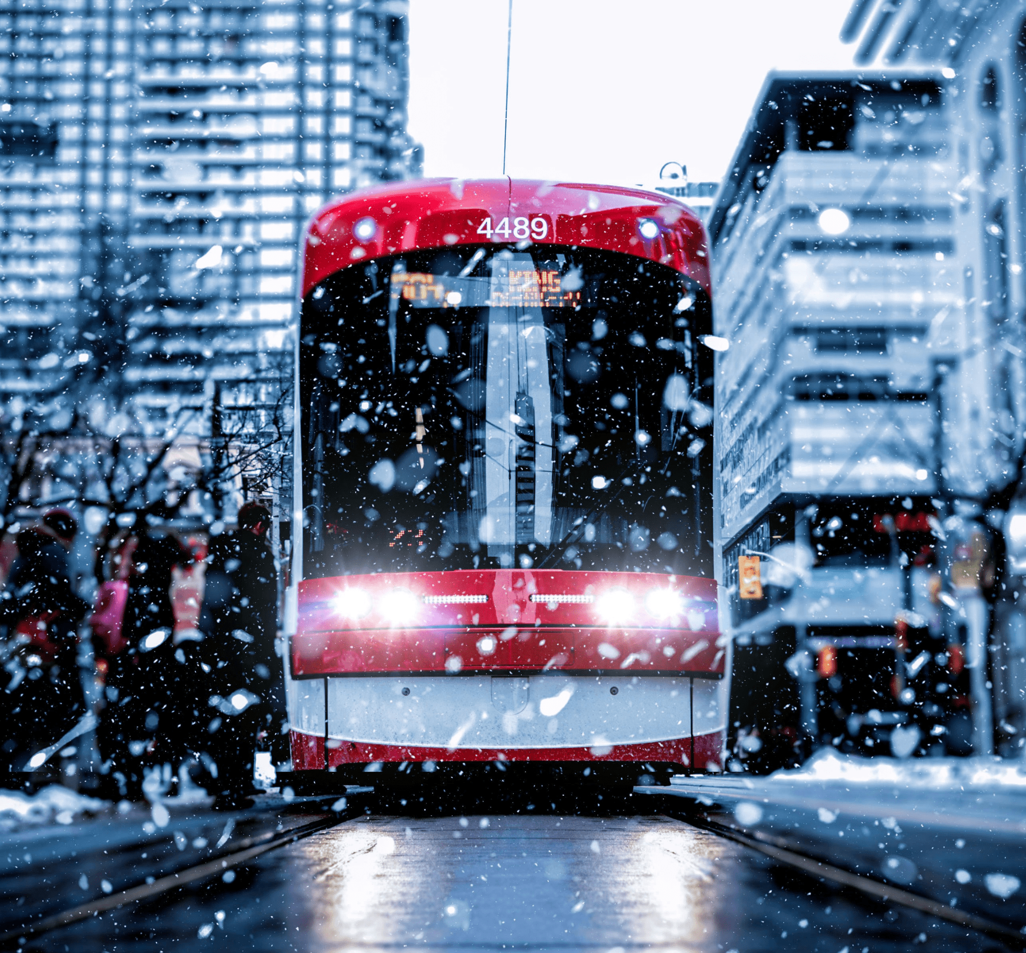 TTC streetcar moving through a wintery day in downtown toronto