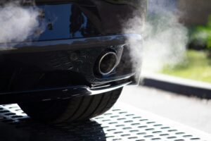 car with polluting emissions coming out of tailpipe