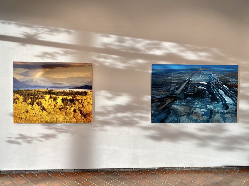 two photographs on the wall at an art exhibit