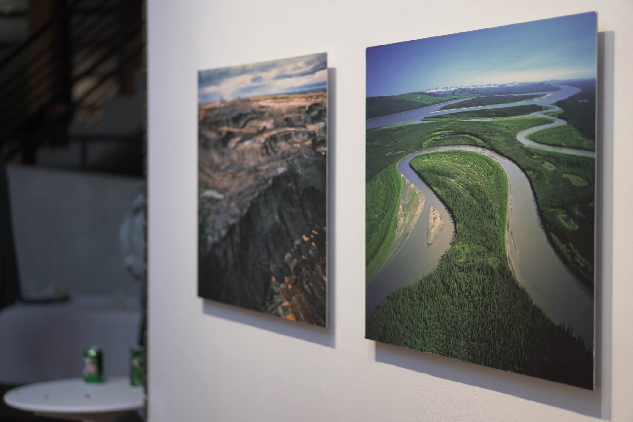Two photographs at an art exhibit
