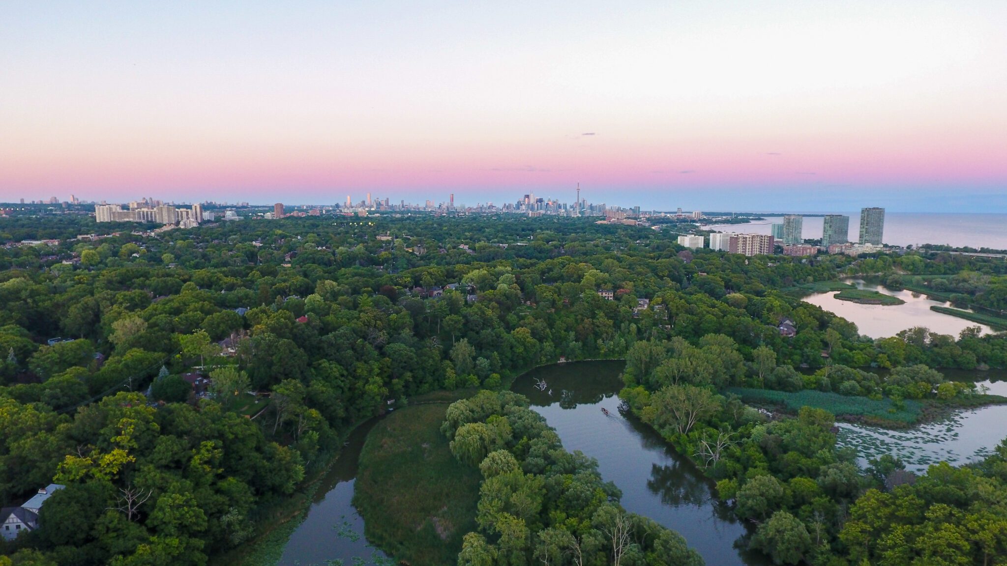 Drone image of the humber river with the city of Toronto on the horizon.