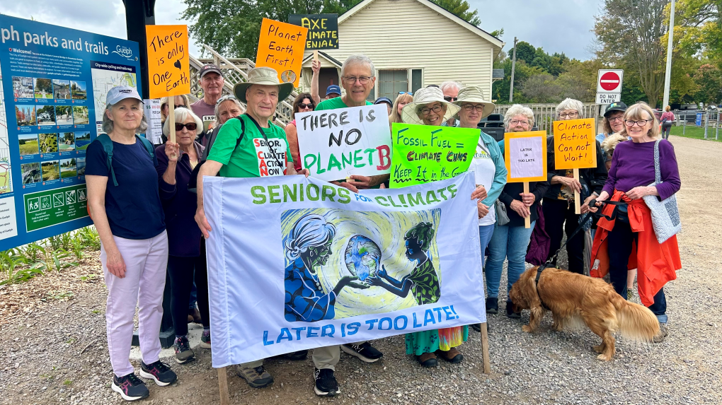 Seniors holding signs about the need for climate action