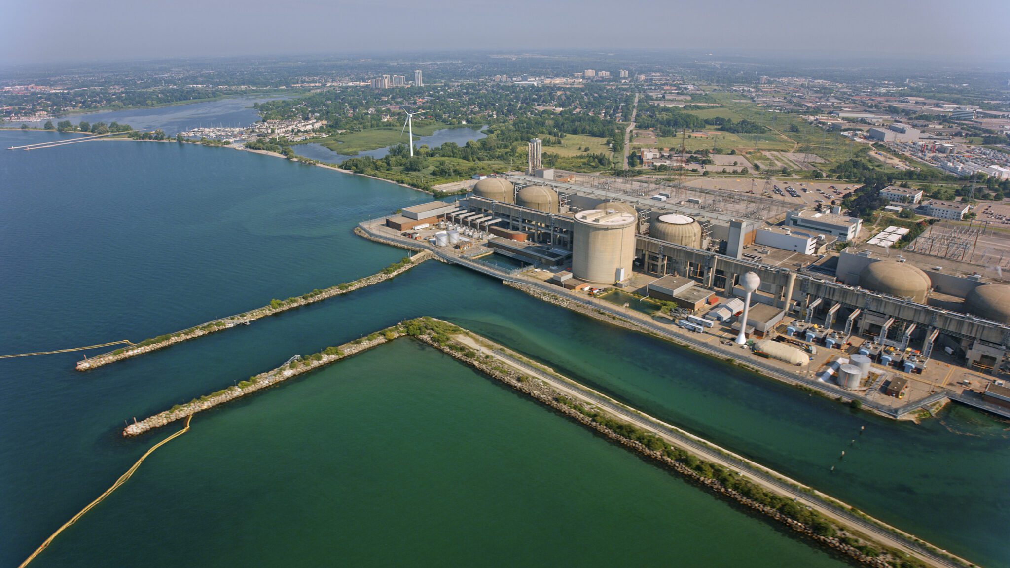 Pickering, Ontario, CA / USA - August 07, 2019: Aerial view of Pickering Nuclear Generating Station on shore of Lake Ontario in Southern Ontario, Canada.

Pickering Nuclear Generating Station is a Canadian nuclear power station located on the north shore of Lake Ontario in Pickering, Ontario. It is one of the largest nuclear stations in the world.